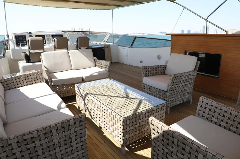  Yacht Photos Pics Luxurious Falcon 90 yacht deck with elegant seating, glass table, and ocean view, 2005 model.