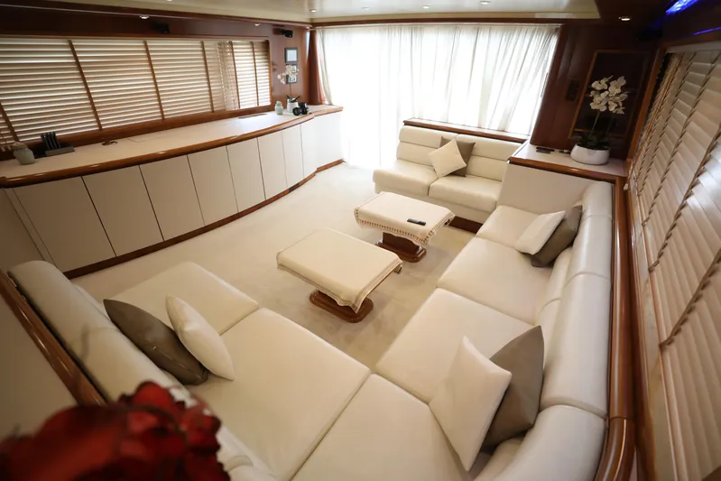  Yacht Photos Pics Luxurious interior of a 2005 Falcon 90 yacht with elegant white seating and wooden accents.