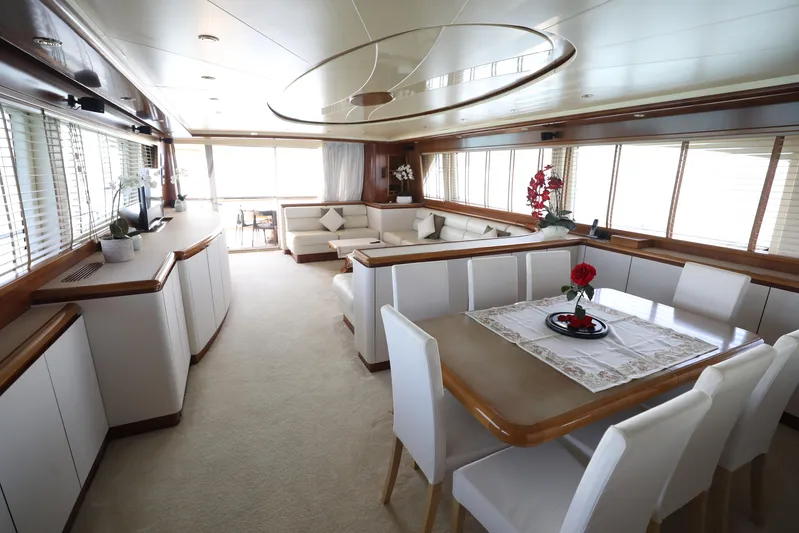  Yacht Photos Pics Luxurious interior of a 2005 Falcon 90 yacht with elegant dining and seating areas.