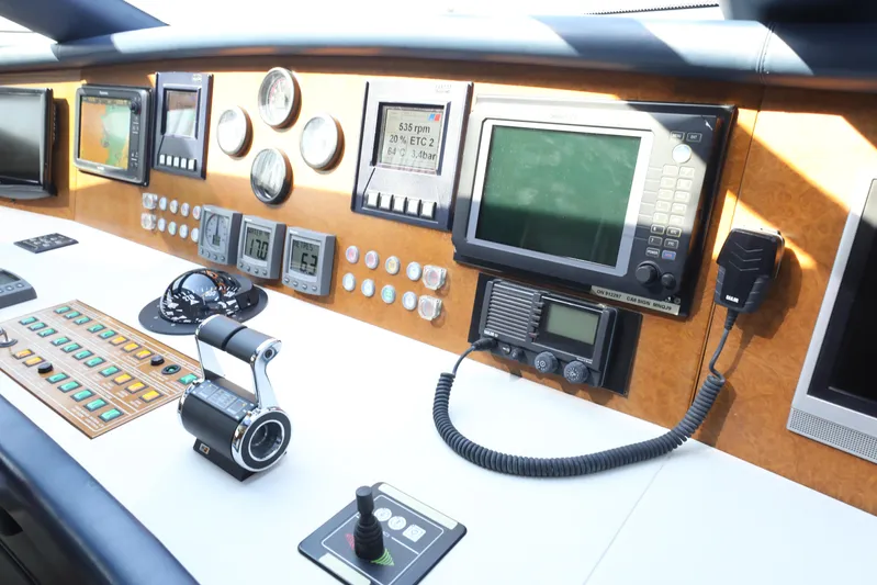  Yacht Photos Pics Control panel of a 2005 Falcon 90 yacht with navigation instruments and communication devices.