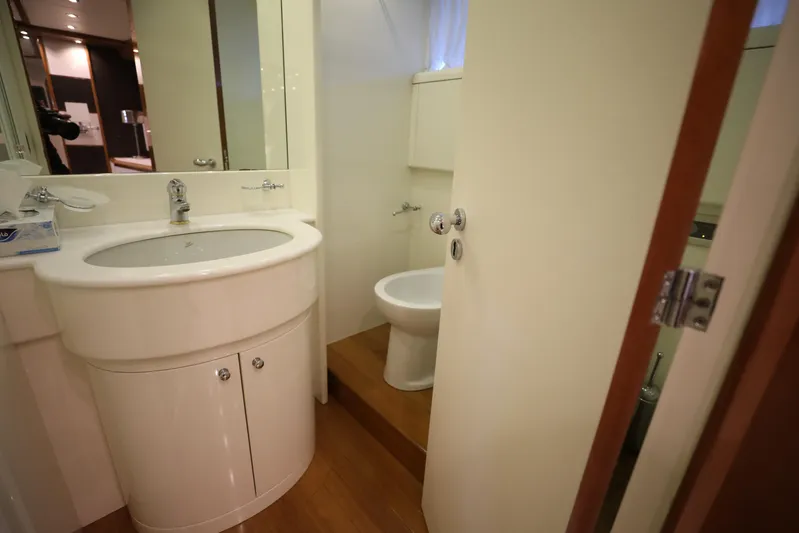  Yacht Photos Pics Compact bathroom in a 2005 Falcon 90 yacht, featuring a sink and toilet.