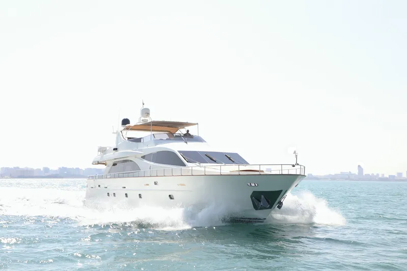  Yacht Photos Pics Luxury Falcon 90 yacht cruising on open water, 2005 model.