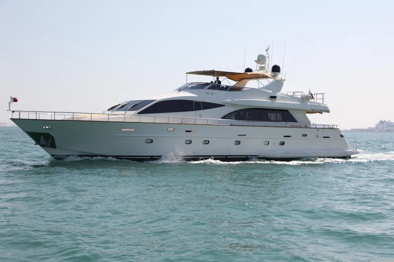  Yacht Photos Pics Luxury Falcon 90 yacht cruising on open water, 2005 model.