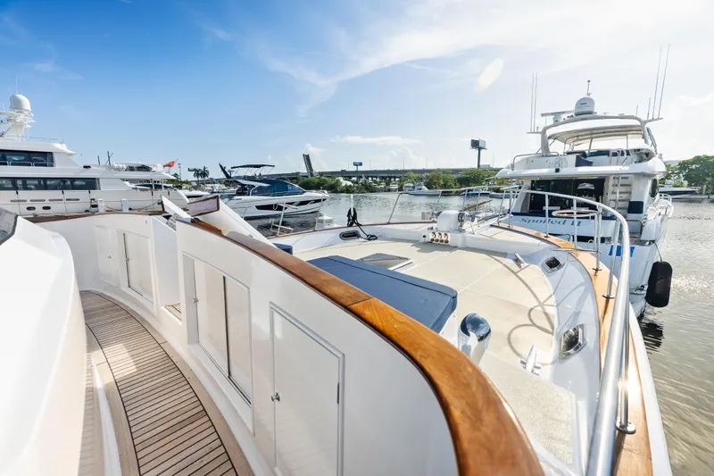 El Legado Yacht Photos Pics 2005 Grand Banks 72 Aleutian RP yacht docked in a sunny marina.