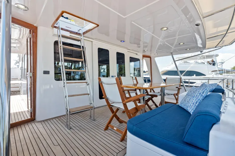 El Legado Yacht Photos Pics Luxurious 2005 Grand Banks 72 Aleutian RP yacht deck with seating and dining area.