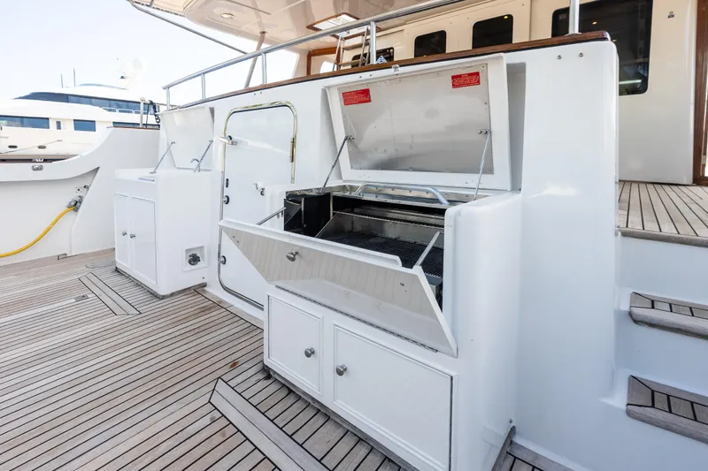 El Legado Yacht Photos Pics Outdoor grill area on 2005 Grand Banks 72 Aleutian RP yacht deck.