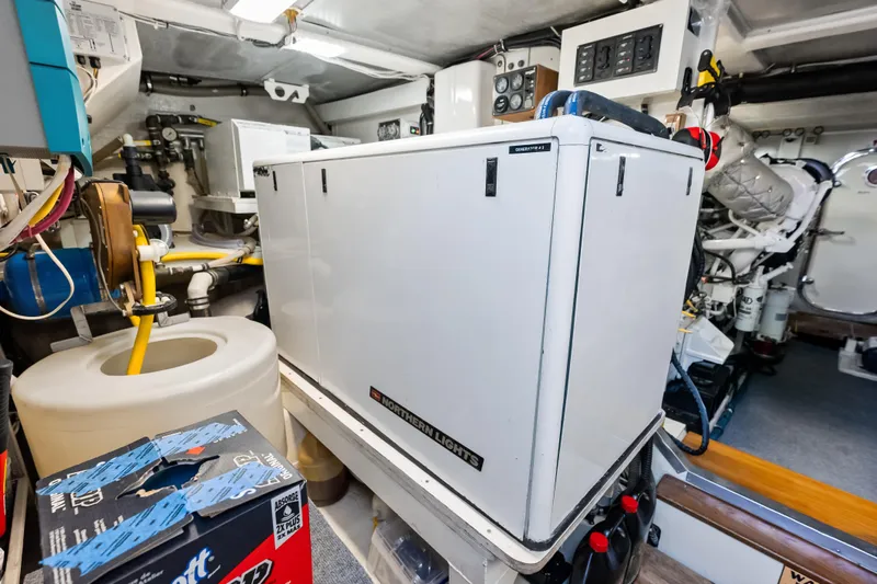 El Legado Yacht Photos Pics Engine room of 2005 Grand Banks 72 Aleutian RP yacht with generator and equipment.