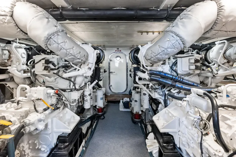 El Legado Yacht Photos Pics Engine room of 2005 Grand Banks 72 Aleutian RP yacht, featuring dual engines.