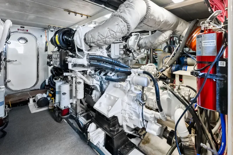 El Legado Yacht Photos Pics Engine room of 2005 Grand Banks 72 Aleutian RP yacht, featuring complex machinery and equipment.