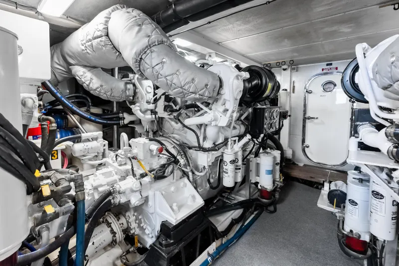 El Legado Yacht Photos Pics Engine room of 2005 Grand Banks 72 Aleutian RP yacht, showcasing machinery and equipment.