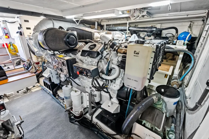 El Legado Yacht Photos Pics Engine room of 2005 Grand Banks 72 Aleutian RP yacht, featuring complex machinery and controls.