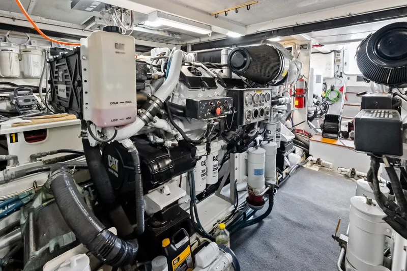 El Legado Yacht Photos Pics Engine room of 2005 Grand Banks 72 Aleutian RP yacht, featuring CAT machinery and equipment.
