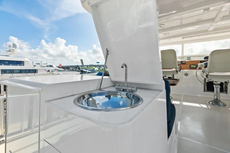 El Legado Yacht Photos Pics 2005 Grand Banks 72 Aleutian RP yacht with outdoor sink and seating area.