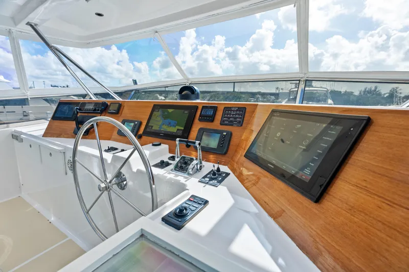 El Legado Yacht Photos Pics Helm of 2005 Grand Banks 72 Aleutian RP yacht with modern navigation equipment.