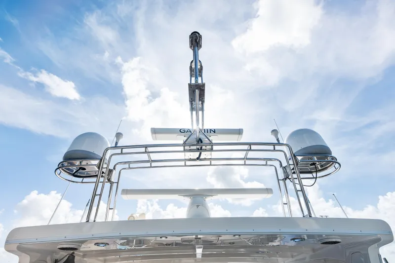 El Legado Yacht Photos Pics Grand Banks 72 Aleutian RP 2005 yacht radar and antennas against a cloudy sky.