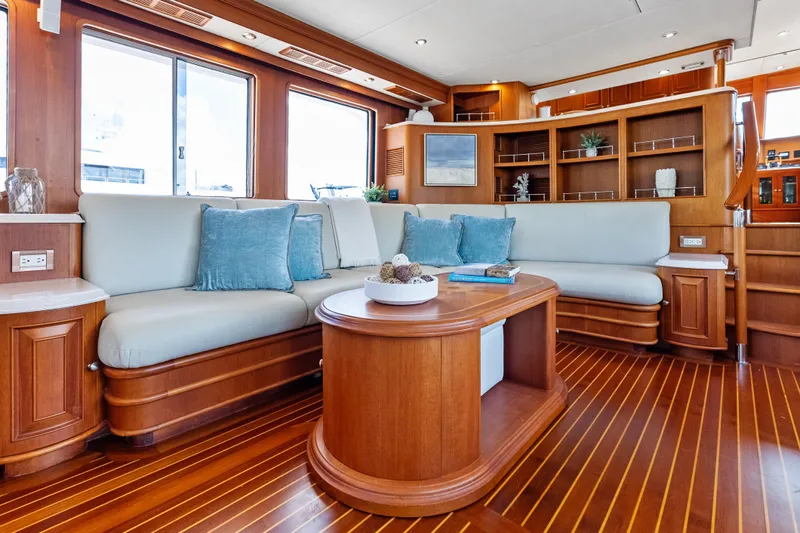 El Legado Yacht Photos Pics Luxurious 2005 Grand Banks 72 Aleutian RP yacht interior with elegant wood finish and plush seating.