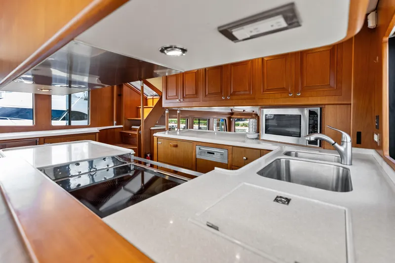 El Legado Yacht Photos Pics Luxurious kitchen interior of 2005 Grand Banks 72 Aleutian RP yacht, featuring modern appliances.