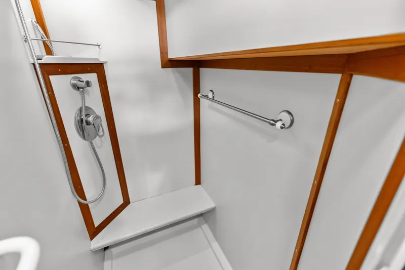 El Legado Yacht Photos Pics Shower area in 2005 Grand Banks 72 Aleutian RP yacht with wooden accents.