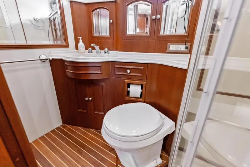 El Legado Yacht Photos Pics Luxurious wooden bathroom interior on 2005 Grand Banks 72 Aleutian RP yacht.