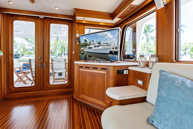El Legado Yacht Photos Pics Luxurious interior of 2005 Grand Banks 72 Aleutian RP yacht with elegant wood finishes.