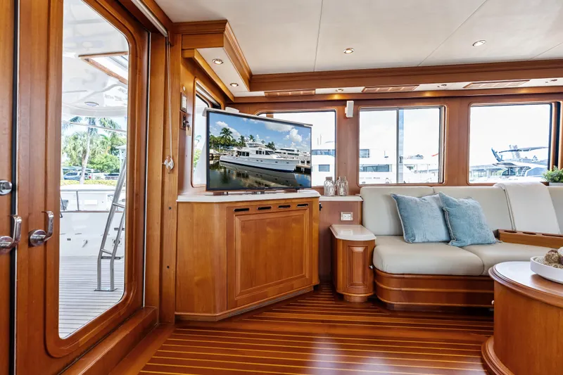 El Legado Yacht Photos Pics Luxurious interior of 2005 Grand Banks 72 Aleutian RP yacht with elegant wood finish.