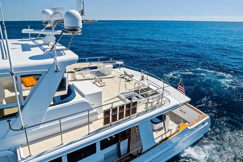 El Legado Yacht Photos Pics Luxurious 2005 Grand Banks 72 Aleutian RP yacht cruising on open sea.