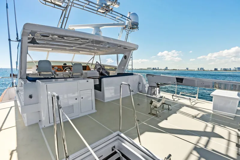 El Legado Yacht Photos Pics 2005 Grand Banks 72 Aleutian RP yacht deck with ocean view and clear sky.