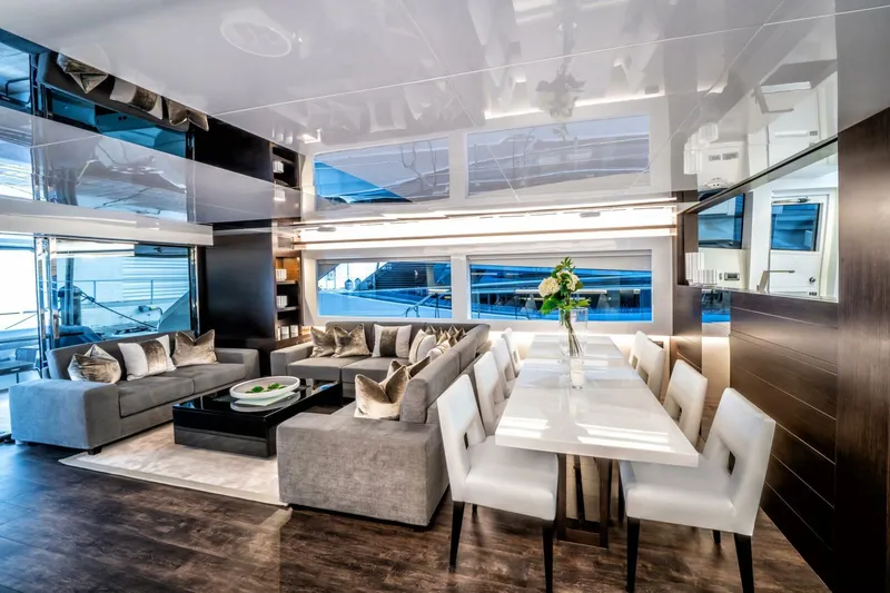  Yacht Photos Pics Luxurious interior of 2020 Pearl 95 yacht with modern dining and seating area.