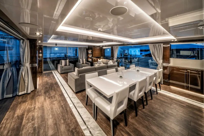  Yacht Photos Pics Luxurious interior of 2020 Pearl 95 yacht with elegant dining and living area.