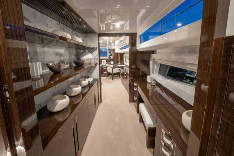  Yacht Photos Pics Luxurious interior of 2020 Pearl 95 yacht with elegant wood finishes and modern decor.