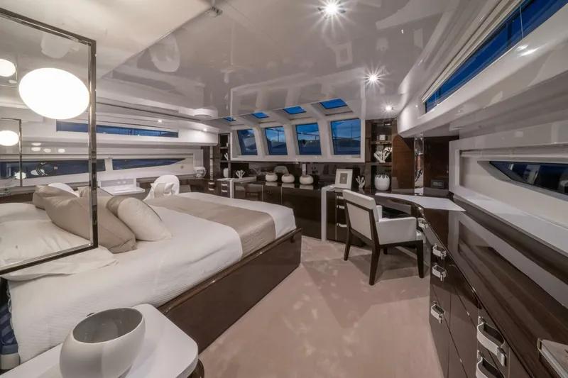  Yacht Photos Pics Luxurious interior of 2020 Pearl 95 yacht with elegant bedroom and modern furnishings.