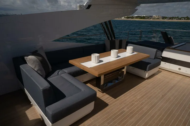  Yacht Photos Pics Luxurious Pearl 95 yacht deck with elegant seating and ocean view, 2020 model.