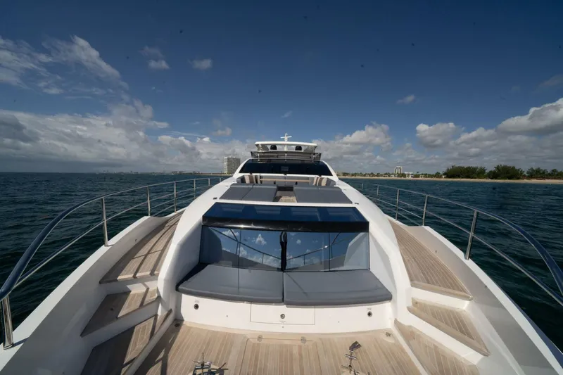  Yacht Photos Pics Luxury Pearl 95 yacht deck, 2020 model, cruising on open sea under clear skies.