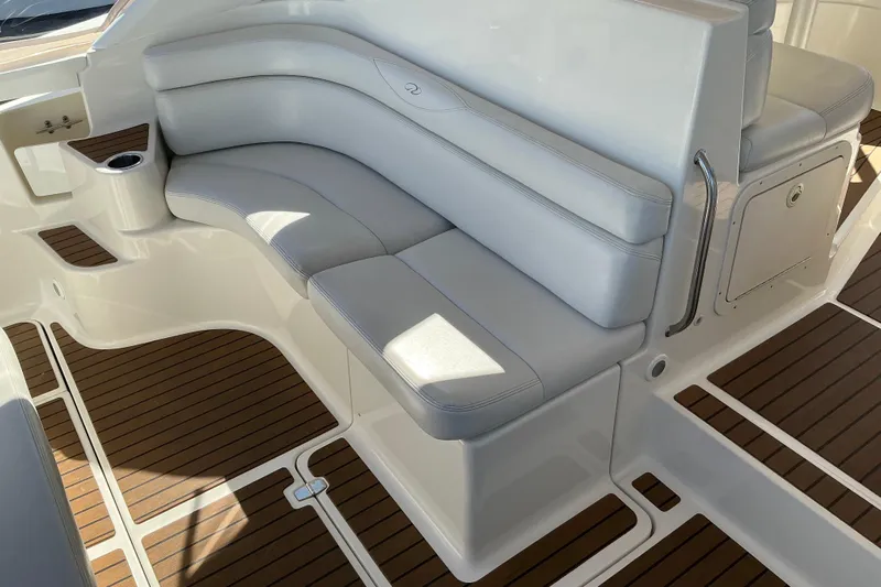 Knee Deep Yacht Photos Pics 2003 Regal Commodore 4260 boat interior with white seating and wood flooring.