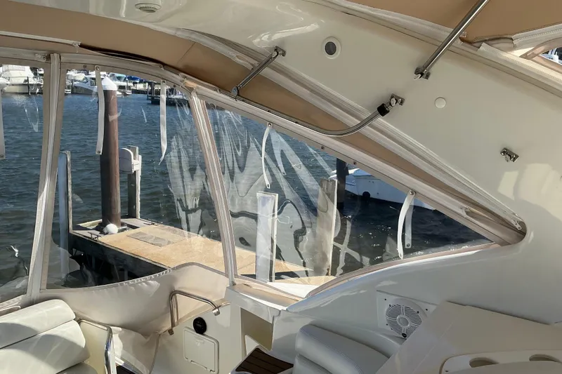 Knee Deep Yacht Photos Pics Interior view of 2003 Regal Commodore 4260 yacht with marina backdrop.