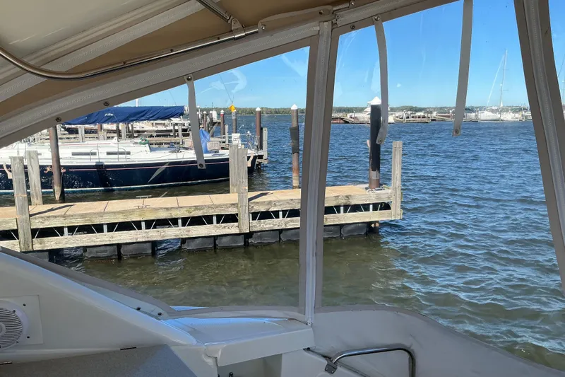 Knee Deep Yacht Photos Pics View from a 2003 Regal Commodore 4260 boat, overlooking a marina dock.