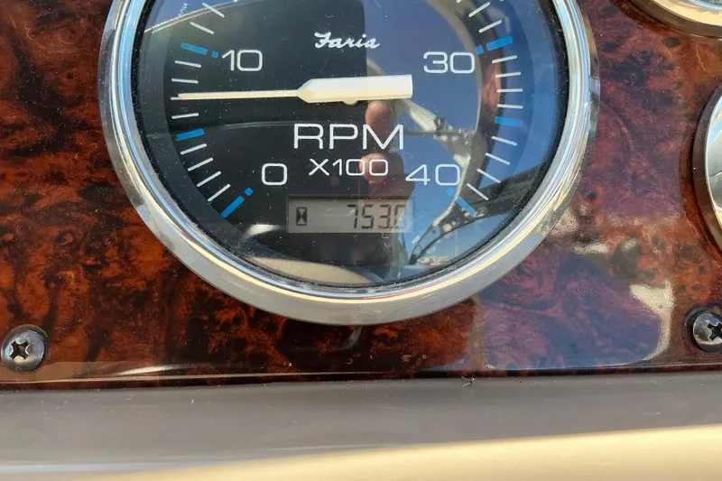 Knee Deep Yacht Photos Pics Close-up of a 2003 Regal Commodore 4260 RPM gauge displaying 753 hours.