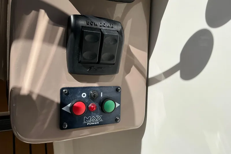 Knee Deep Yacht Photos Pics Control panel on a 2003 Regal Commodore 4260 boat, featuring buttons and switches.