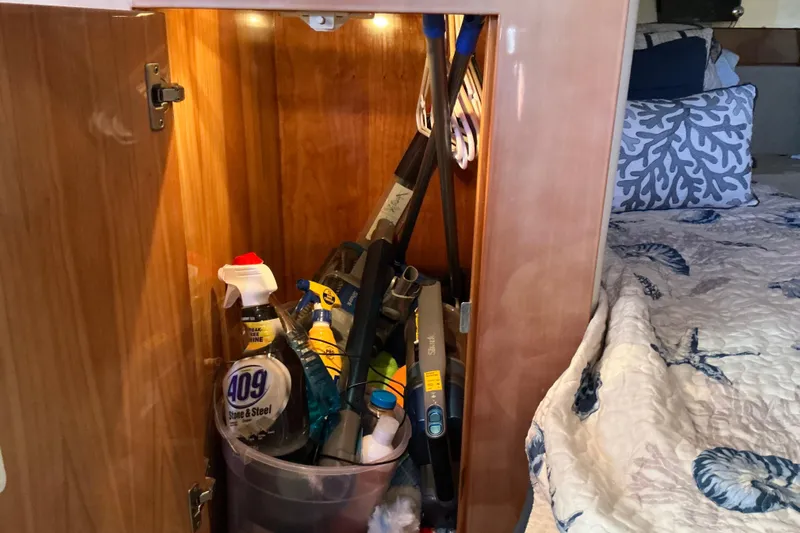 Knee Deep Yacht Photos Pics Cabinet in 2003 Regal Commodore 4260 yacht with cleaning supplies and tools.