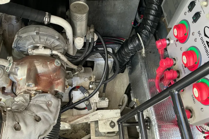 Knee Deep Yacht Photos Pics Engine compartment of 2003 Regal Commodore 4260 with control panel and wiring.