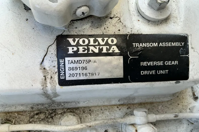 Knee Deep Yacht Photos Pics Volvo Penta engine label on 2003 Regal Commodore 4260, featuring TAMD75P model details.