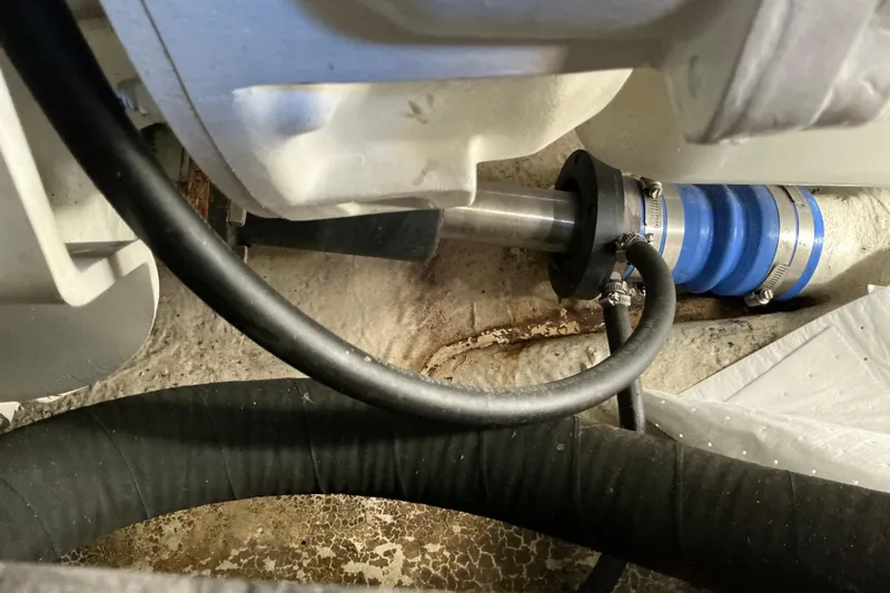 Knee Deep Yacht Photos Pics Engine compartment of 2003 Regal Commodore 4260 with visible hoses and fittings.