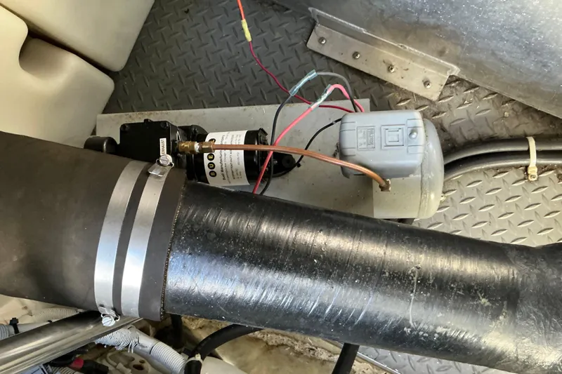 Knee Deep Yacht Photos Pics Engine compartment of 2003 Regal Commodore 4260 with wiring and components visible.