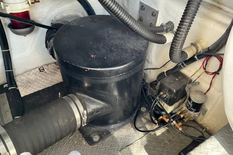 Knee Deep Yacht Photos Pics Engine compartment of 2003 Regal Commodore 4260, featuring mechanical components and wiring.