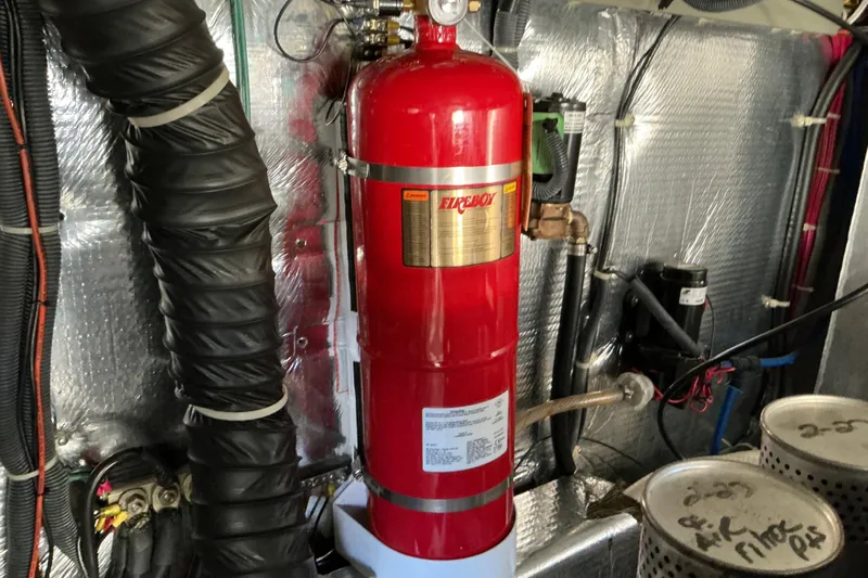 Knee Deep Yacht Photos Pics Engine room of 2003 Regal Commodore 4260 with Fireboy fire suppression system.