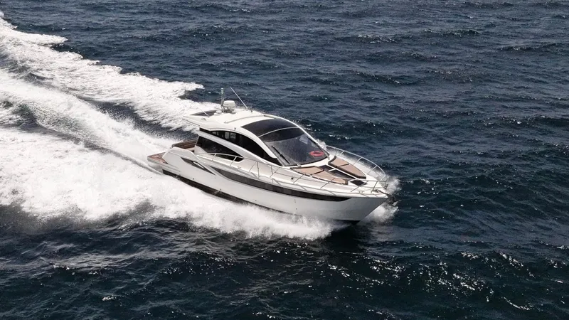 Keep Paddlin Yacht Photos Pics 2019 Galeon 430 HTC yacht cruising on open sea, creating a dynamic wake.