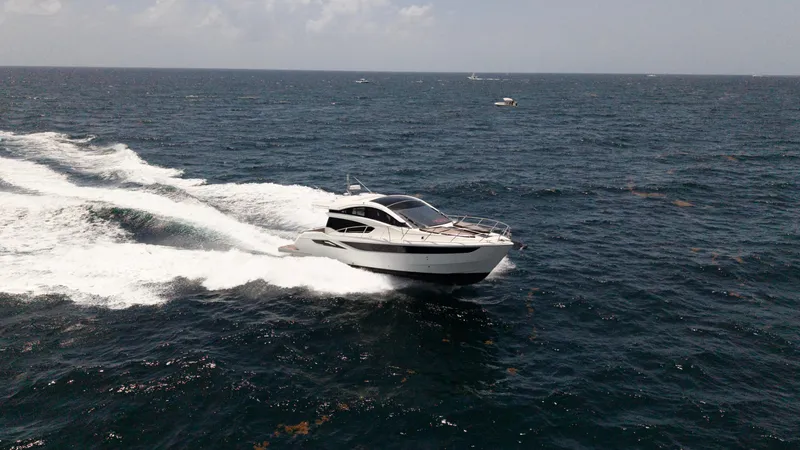 Keep Paddlin Yacht Photos Pics 2019 Galeon 430 HTC yacht cruising on open sea under clear skies.