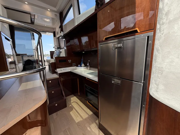 Keep Paddlin Yacht Photos Pics Luxurious interior of 2019 Galeon 430 HTC yacht with modern kitchen and sleek design.