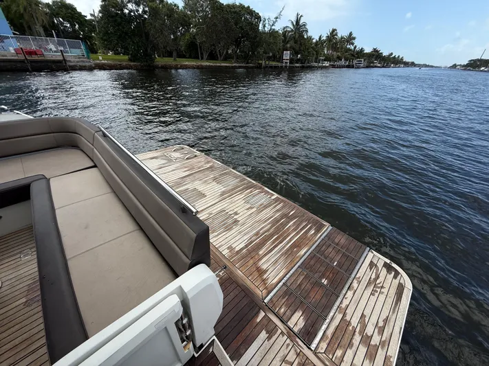 Keep Paddlin Yacht Photos Pics 2019 Galeon 430 HTC yacht deck with waterfront view and lush greenery.