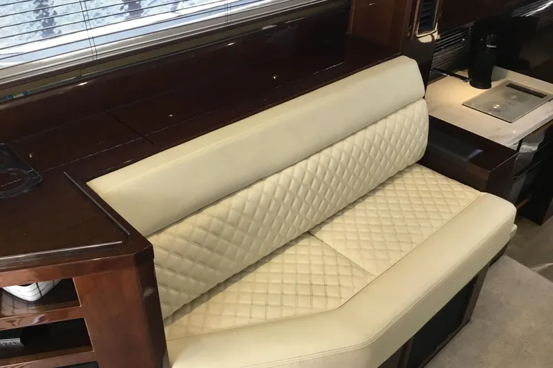 Keep Paddlin Yacht Photos Pics Luxurious interior seating on 2019 Galeon 430 HTC yacht with quilted cream upholstery.
